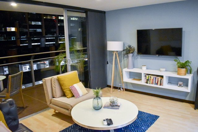 A modern living room opened to a balcony