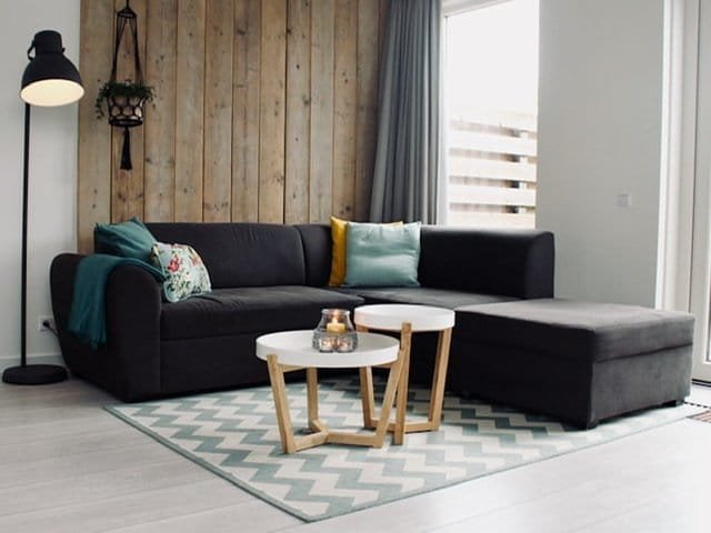 Dark gray L-shaped sofa in a living room.