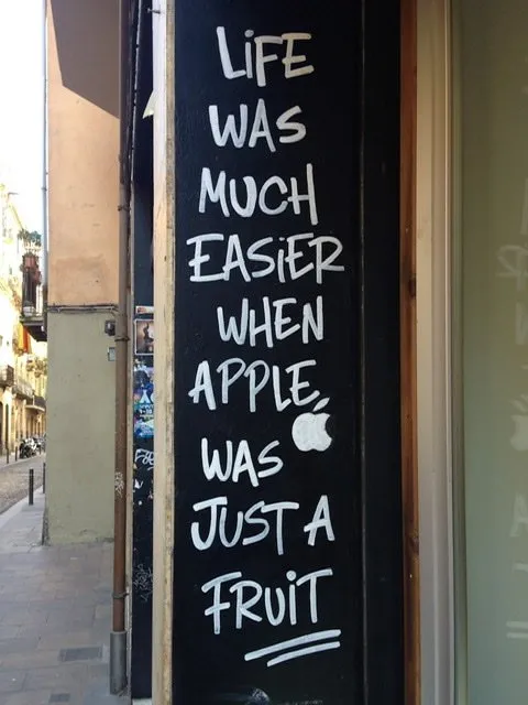 A sign that reads “Life was much easier when apple was just a fruit”