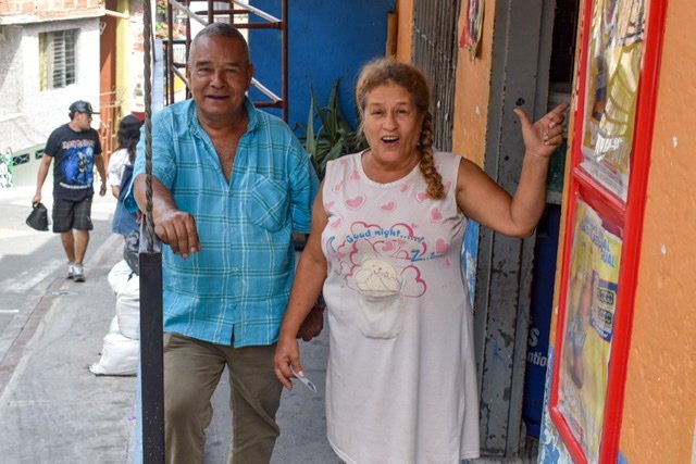 Man and woman standing on a porch in Medellin