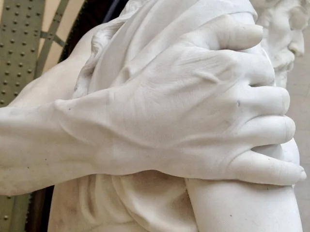 Detail of a hand on an arm of a statue
