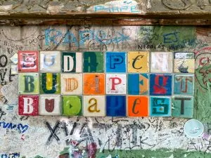 Colorful tiles spelling out “Budapest” three times