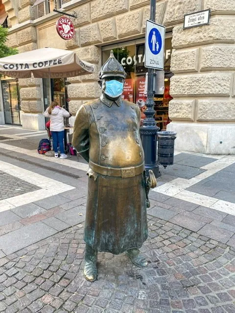 Statue of a policeman with a large belly