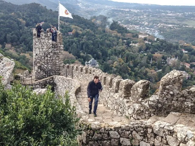 Man walking on a castle wall