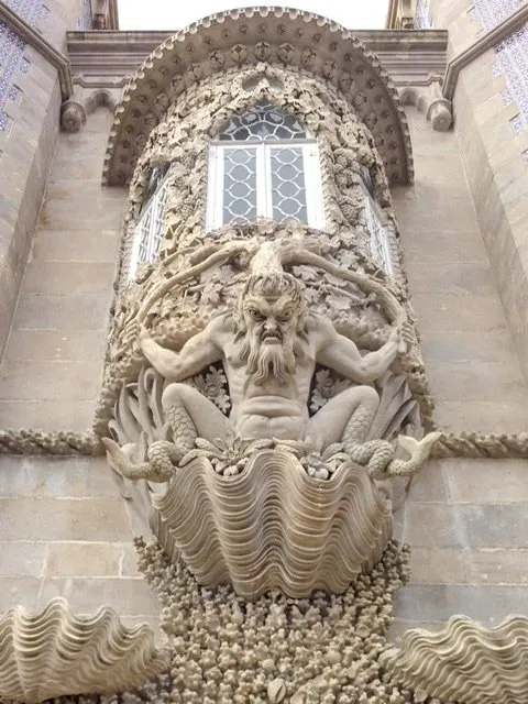 Gargoyle-like creature on the outside of a building