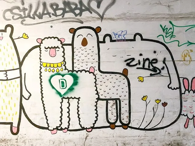 A drawing of two stylized llamas