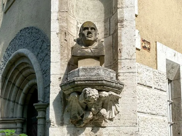 A bust of the actor Bela Lugosi on a castle wall