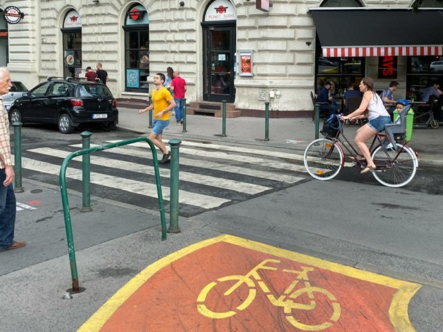 A street with a bike lane and a crosswalk