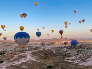 a group of hot air balloons in the sky