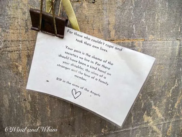 a card with a clip on a wood surface