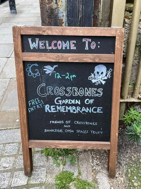 Chalkboard welcoming people to Crossbones Graveyard