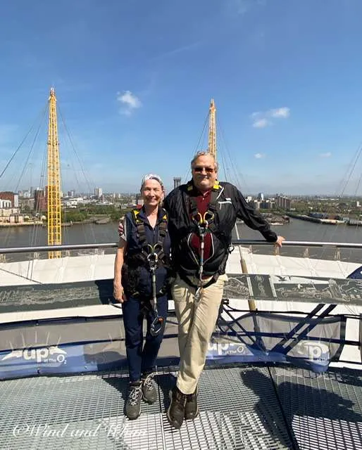a man and woman standing on a platform