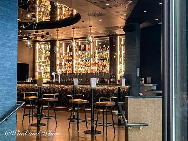 a bar with shelves of liquor