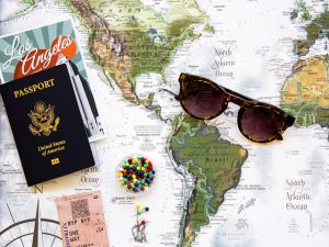 a map with sunglasses and travel-related items on it