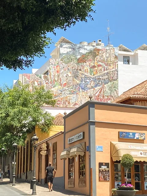 A mural of a town above buildings