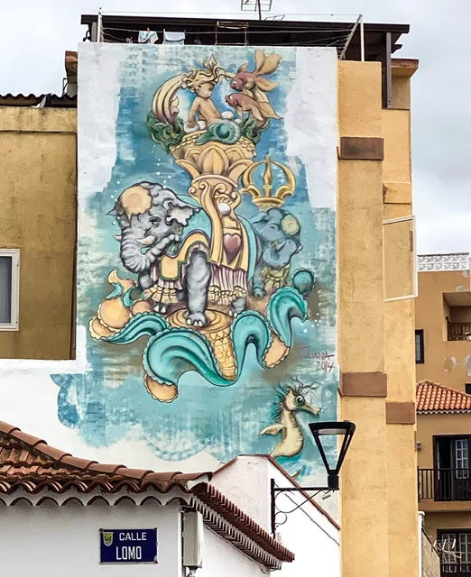 a mural of elephants and seahorse
