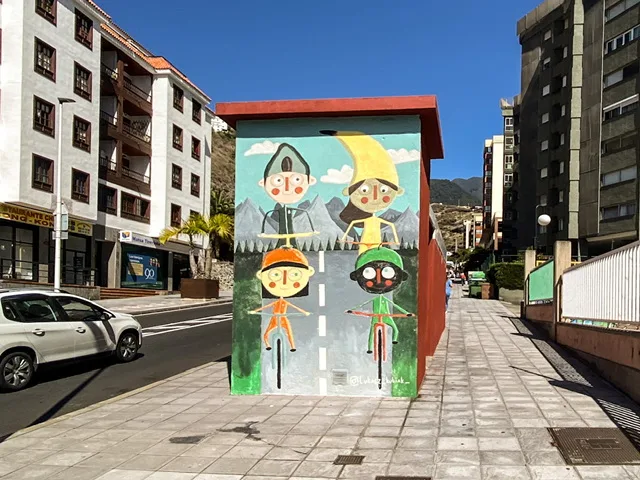 A mural of four children riding bikes