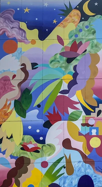 a colorful wall with flowers