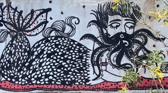 A mural of a merman