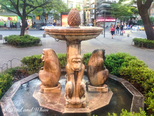 A fountain with monkey figurines