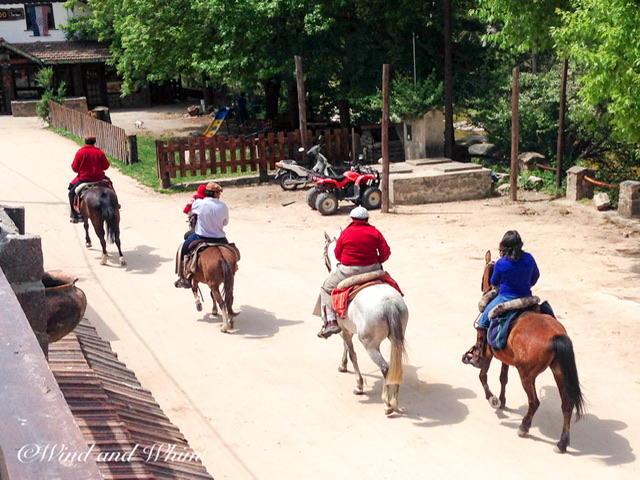 Four people on horseback