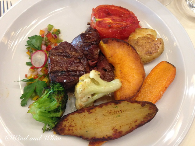 A plate with steak and vegetables