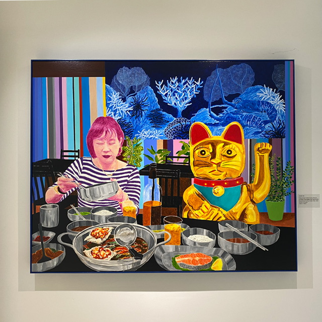 A painting of a woman eating while seated next to a Chinese waving cat