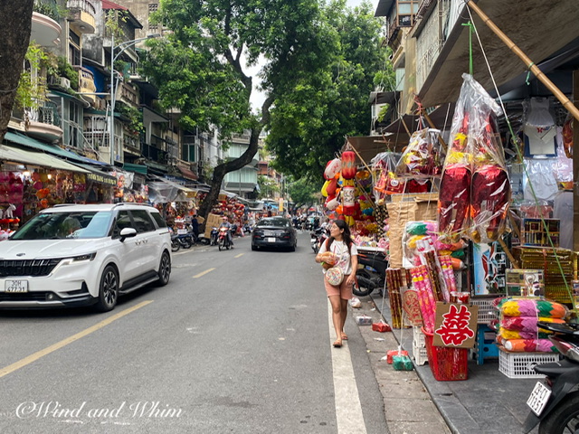 Stores selling party decorations on both sides of a street