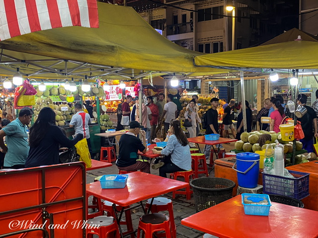 People walking and eating in an informal setting