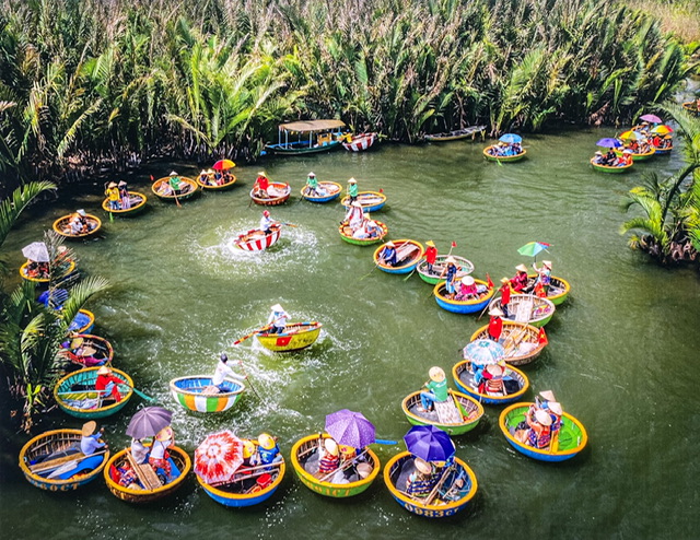 A photo of dozens of colorful basket boats on a river