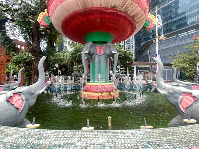 A colorful fountain with elephants