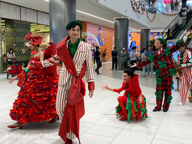 People dancing in red and green outfits