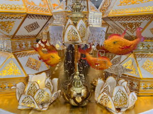 White and gold decorations with orange fish