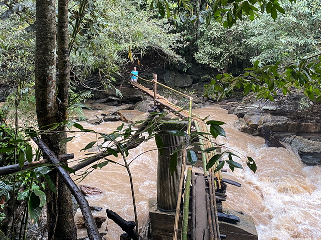 A rickety bridge over moving water