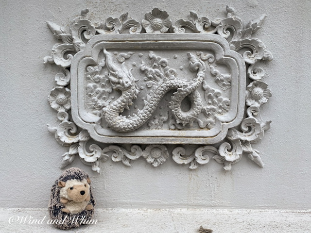 A dragon relief and a toy hedgehog