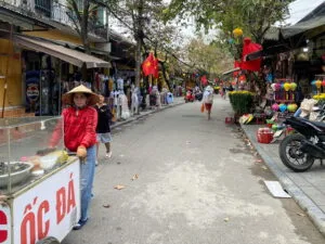 People walking on a street full of shops