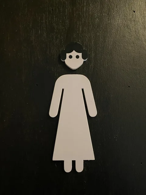 A Princess Leia cutout on a ladies' room door