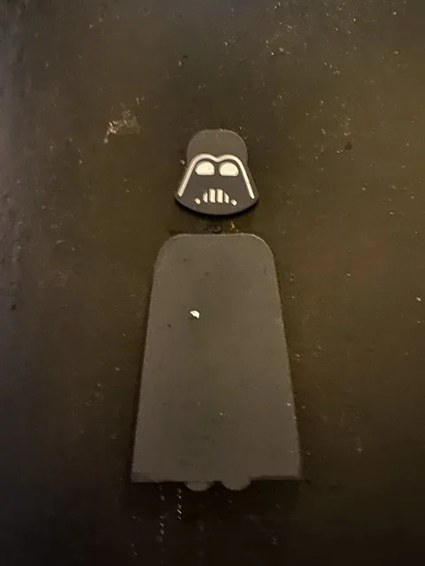 A Darth Vader cutout on a men’s room door