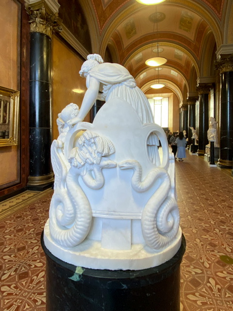 The back of a statue with two snakes