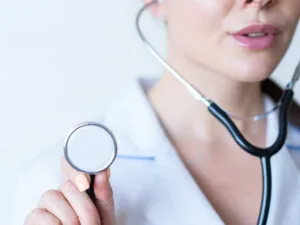 A woman holding a stethoscope