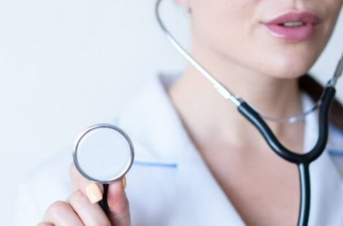 A woman holding a stethoscope