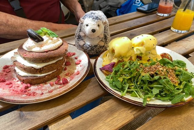 Pancakes with icing and eggs Benedict
