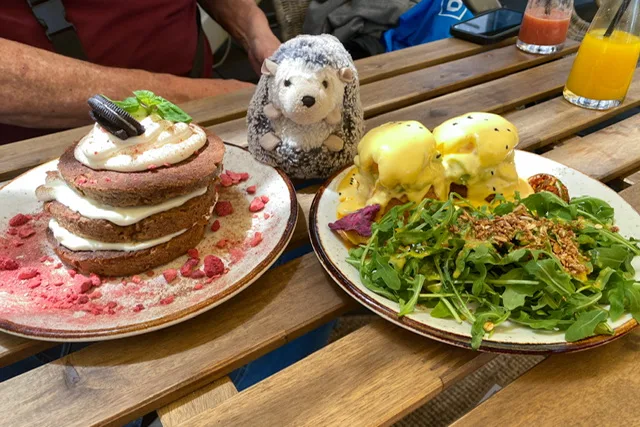Pancakes with icing and eggs Benedict