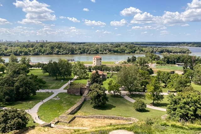 View of ruins, a tower, and a river