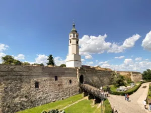 The entrance to a fortress with a drawbridge and tower