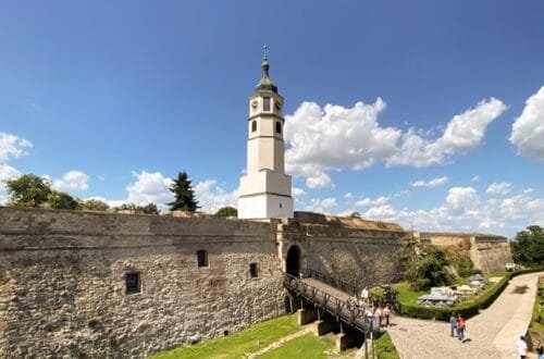 The entrance to a fortress with a drawbridge and tower