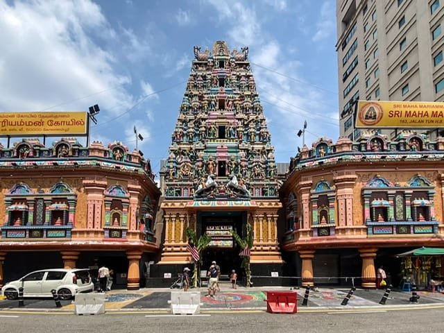 The front of a colorful and ornate Hindu temple