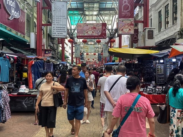 People walking through a Chinese market