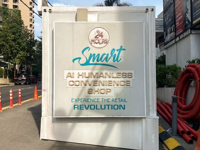A sign advertising a humanless convenience shop