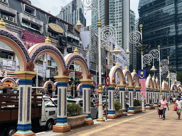 Tall, colorful arches along a sidewalk